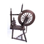 A 19th century spinning wheel.