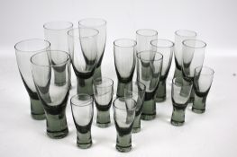 A set of vintage grey glass drinking glasses. Of varying sizes, Max.
