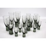 A set of vintage grey glass drinking glasses. Of varying sizes, Max.