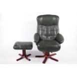 A green leather easy lounge armchair and matching foot stool.