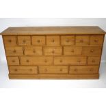 A contemporary pine chest of drawers.