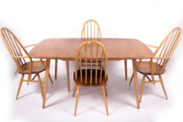 Vintage / Retro : A Blonde Ercol (Blue label) extendable table (with a fifth leg) and four Windsor