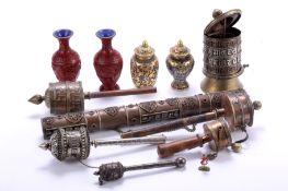 A collection of six assorted copper and white Tibetan metal prayer wheels,