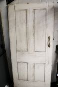 A vintage solid wood panelled front door.