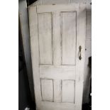 A vintage solid wood panelled front door.