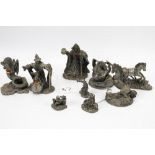 A collection of assorted Myth and Magic Collectors Club ornaments.