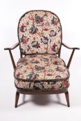 An Ercol dark stained open armchair.