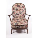 An Ercol dark stained open armchair.