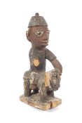 Ethnographic Native Tribal : A Nigerian carved wooden and polychromed figure,