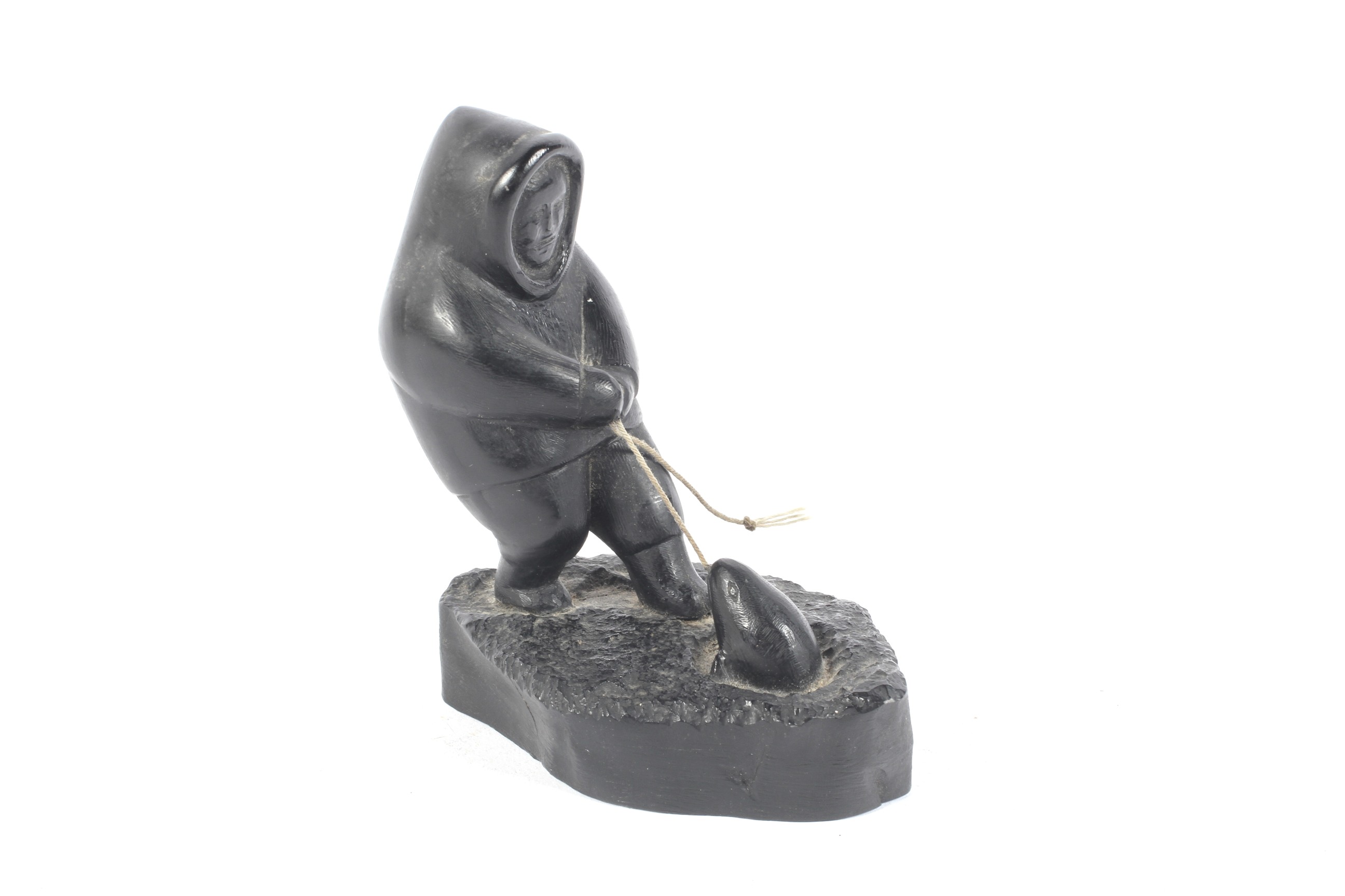 'Boma , Canada ' an Inuit/ eskimo carving of a fisherman pulling an animal out of an ice hole, - Image 5 of 6