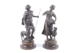 A pair of bronze paternated sculptures.