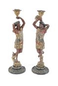 A pair of circa 1900 polychrome spelter candlesticks in the form of figures stood on Georgian