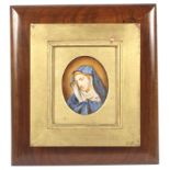 A framed late 19th century oval portrait miniature of the Virgin Mary, watercolour on ivory. 8.