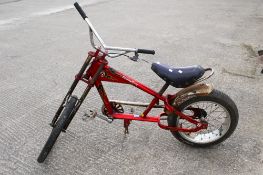 A Schwin 'Sting Ray' bicycle. With a red