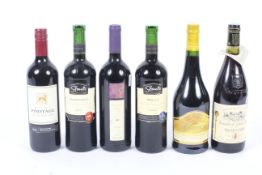 Six bottles of red wine. Comprising: Pin