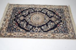 A 20th century Eastern carpet. Featuring