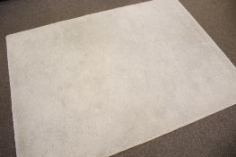 A contemporary cream rug. Of rectangular