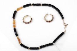 An Ethiopian opal and black-onyx square bead necklace and a pair of earrings.