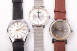 Three vintage gentleman's stainless steel wristwatches.
