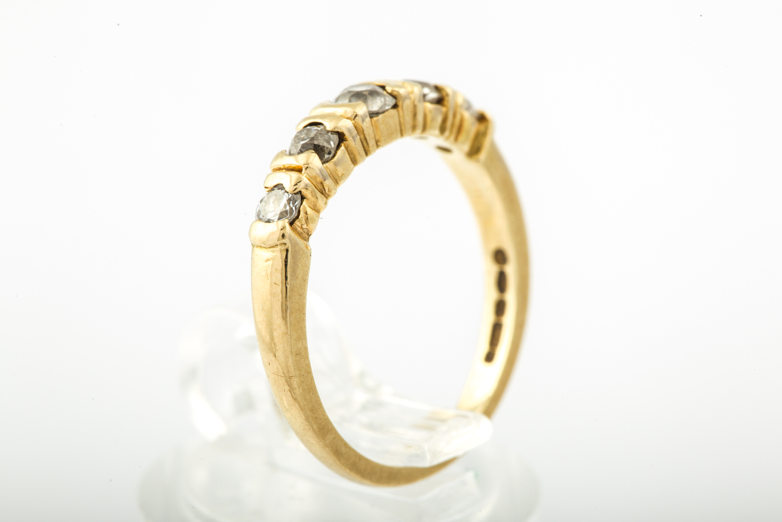 A modern 18ct gold and diamond five stone ring. The graduated old-cut stones approx. 0. - Image 7 of 10