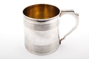 A George III silver christening mug.