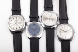 Four vintage gentleman's stainless steel tonneau or cushion-shaped shaped wristwatches, circa 1970.