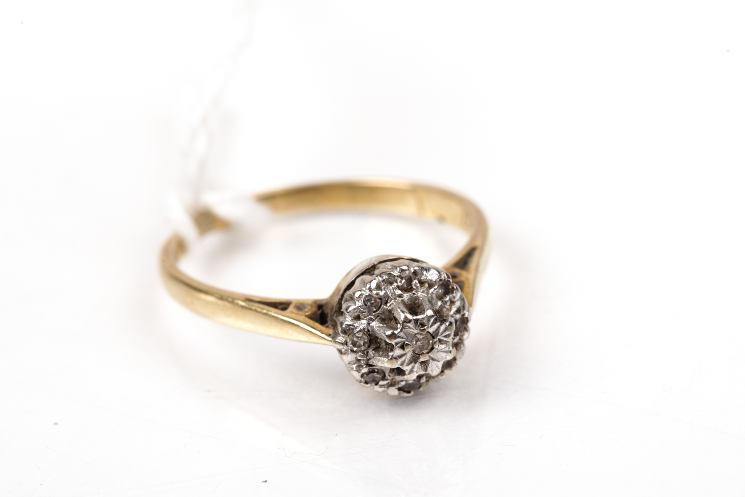 A vintage 18ct gold and diamond nine stone cluster ring.