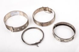 Four silver bangles.