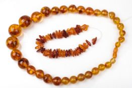 An amber chip necklace and a reconstituted-amber round-bead necklace.