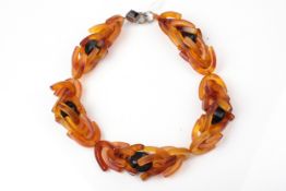 A tortoiseshell and black bead necklace.
