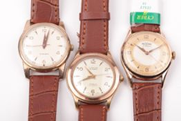 Three vintage gentleman's gold-plated and stainless steel wristwatches, circa 1960.