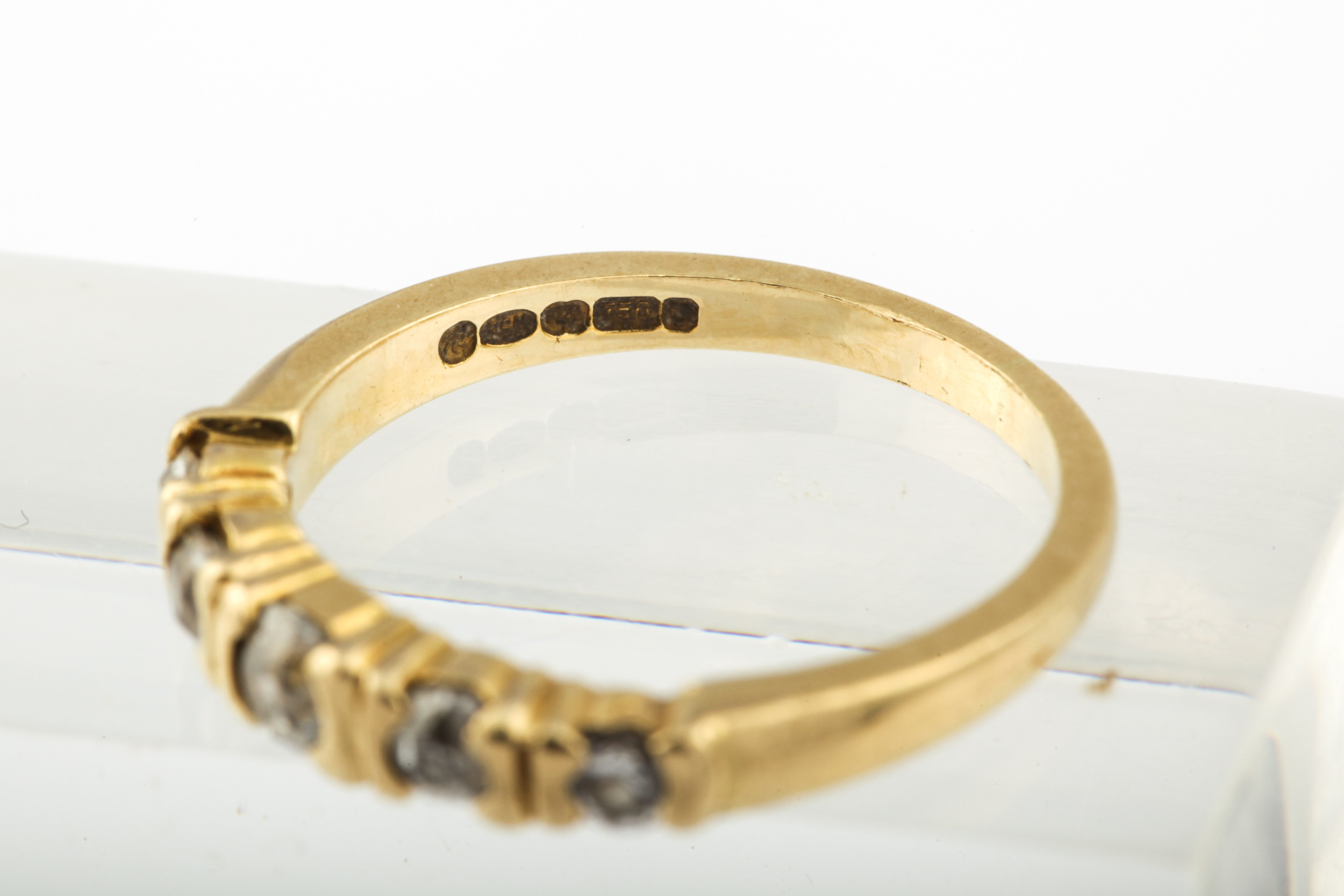 A modern 18ct gold and diamond five stone ring. The graduated old-cut stones approx. 0. - Image 8 of 10