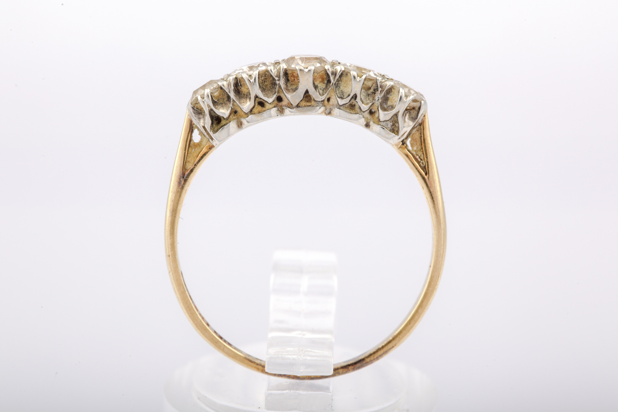 A mid-20th century gold and diamond five stone ring. The graduated old-cut stones approx. 0. - Image 2 of 5