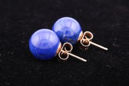 A pair of lapis lazuli stud earrings.