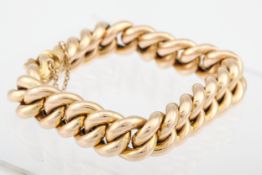 A late Victorian gold hollow curb bracelet. On a push snap, the tongue stamped '15', 32.