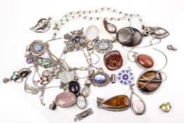 A collection of silver and white metal stone set jewellery.