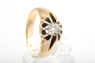 An early 20th century gold and diamond solitaire gypsy ring.