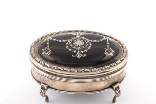 An early 20th century silver and tortoiseshell pique oval trinket box.