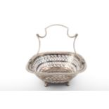 A silver small oblong cake basket.