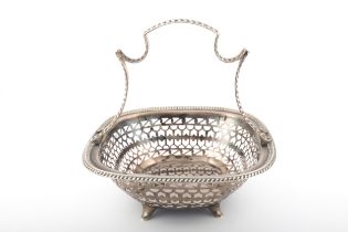 A silver small oblong cake basket.