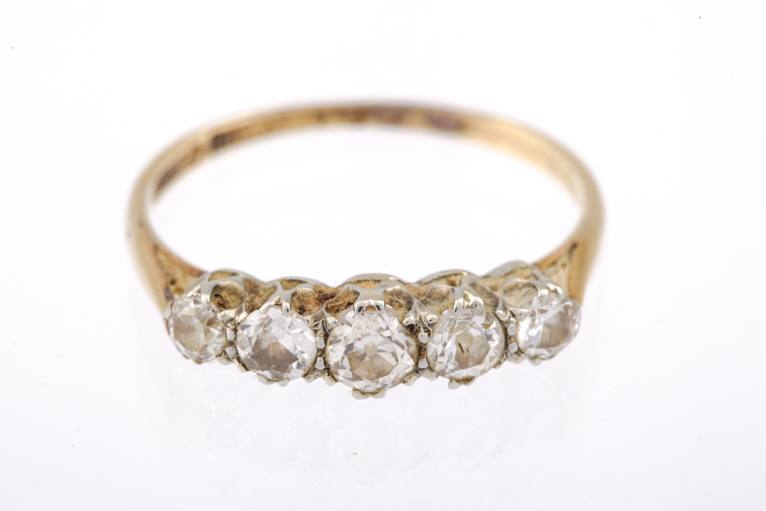 A mid-20th century gold and diamond five stone ring. The graduated old-cut stones approx. 0. - Image 5 of 5