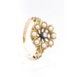 A Victorian gold, half-pearl and diamond open flower-head cluster later adapted as a ring.