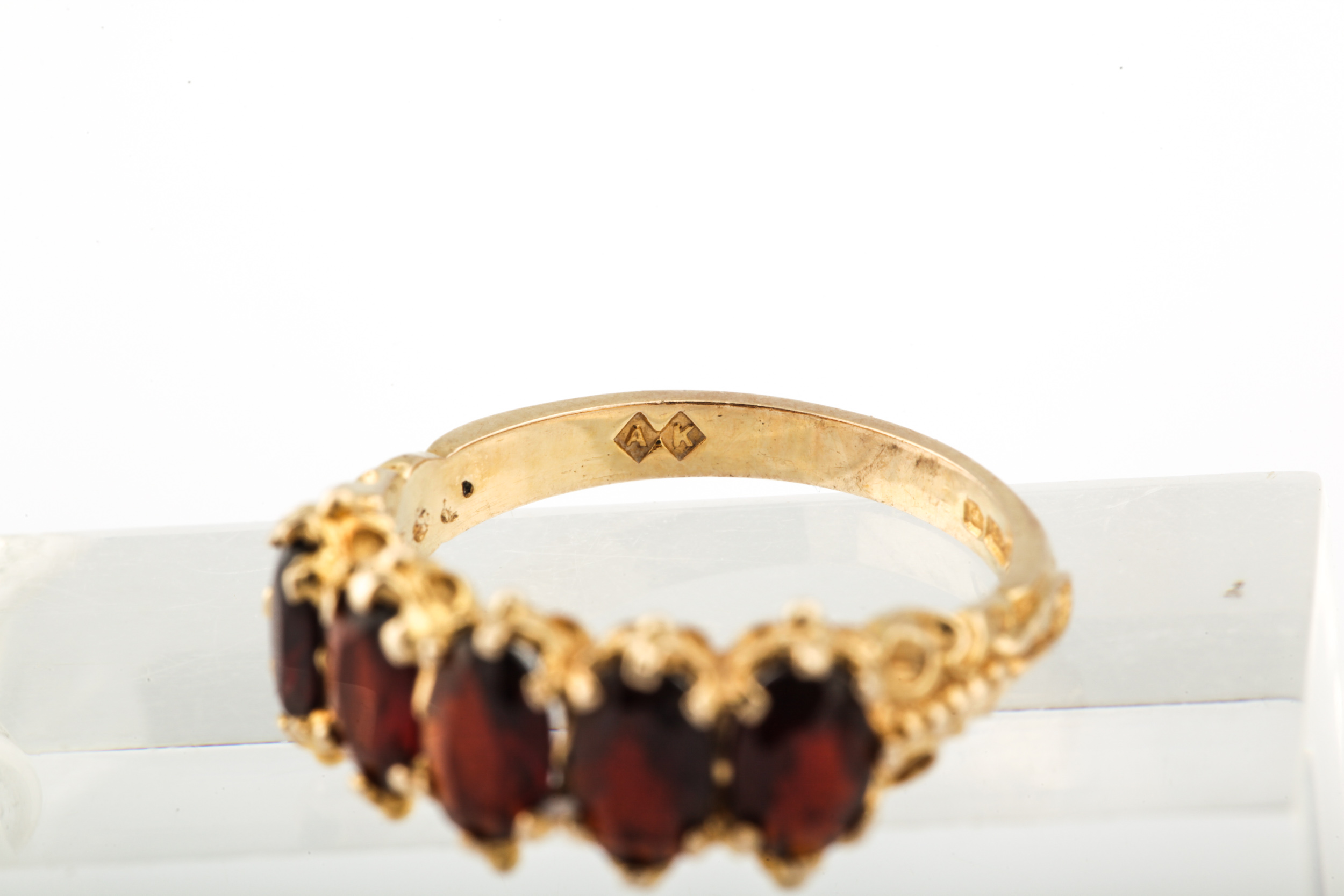 A vintage 9ct gold and garnet five stone ring. - Image 5 of 6