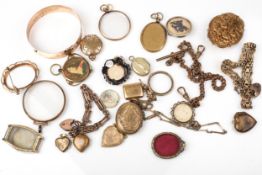 A collection of Victorian and later gold-plated lockets and other items.