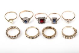 A group of nine vintage gold and gem set rings.