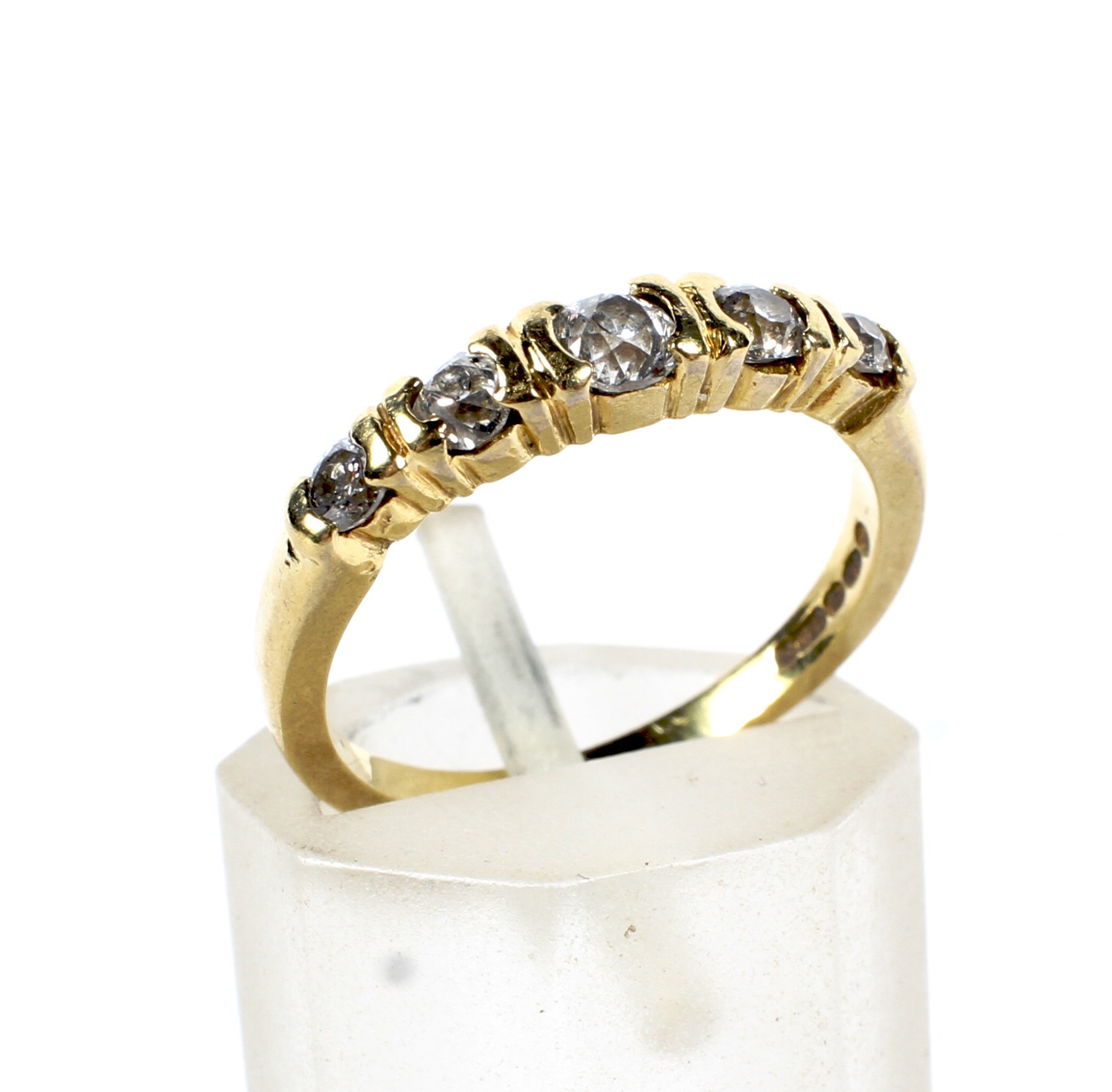 A modern 18ct gold and diamond five stone ring. The graduated old-cut stones approx. 0.