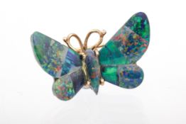 A 1950s gold and black-opal-doublet 'butterfly' brooch.