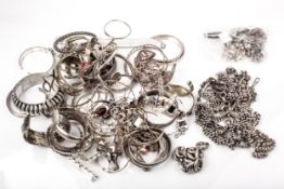 A large collection of silver and white metal bangles, bracelets etc.