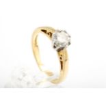 A diamond solitaire ring. The round brilliant approx. 0.