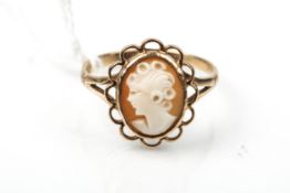 A 9ct gold and small oval shell cameo ring.